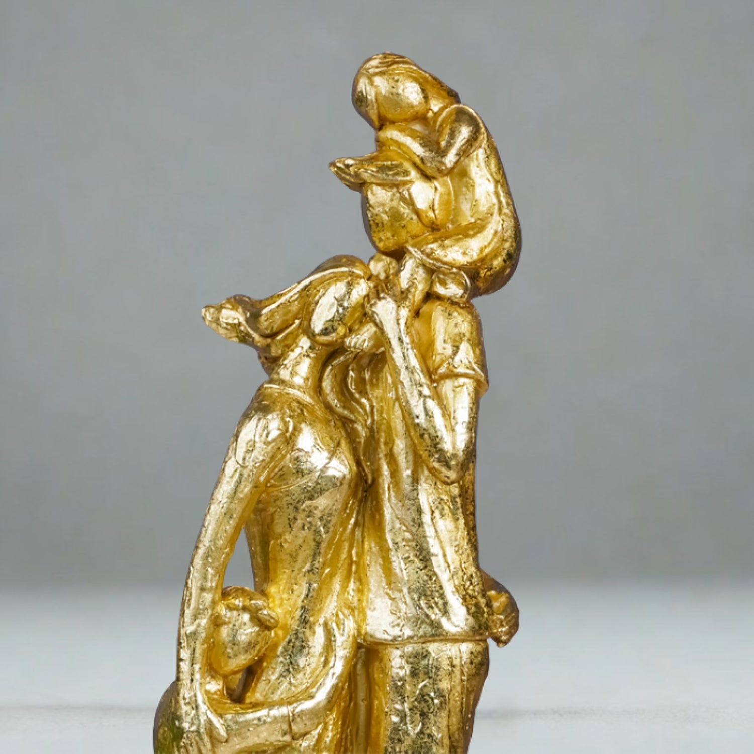Golden Family Embrace Sculpture