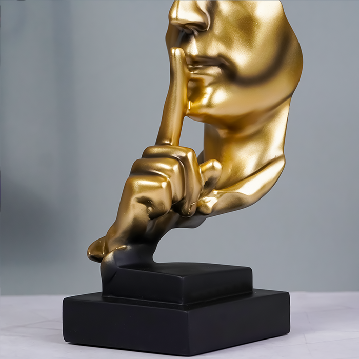 Gold Face Sculpture with Shhh Gesture