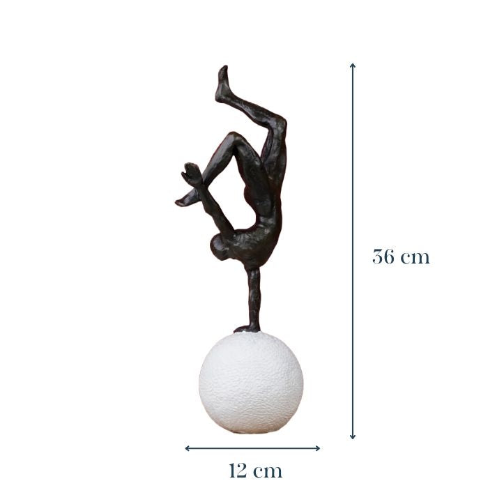 Black Gymnast Sculpture on White Sphere