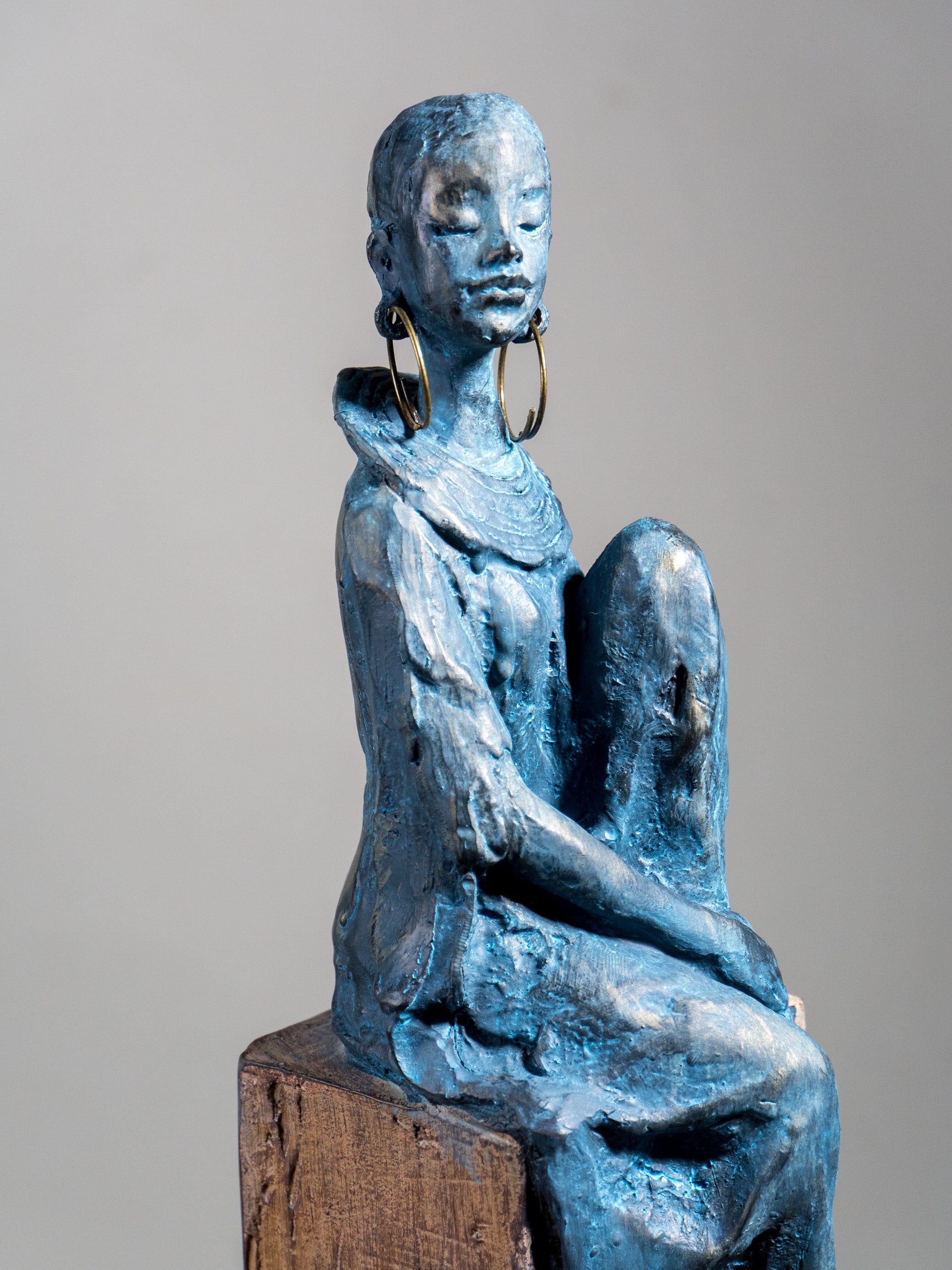 Seated Woman Sculpture on Wood Textured Pedestal – Profile Pose Figure Statue