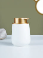 Elegant White Soap Dispenser with Gold Accents