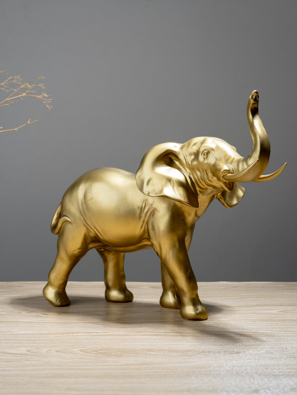 Golden Elephant Figurine with Raised Trunk