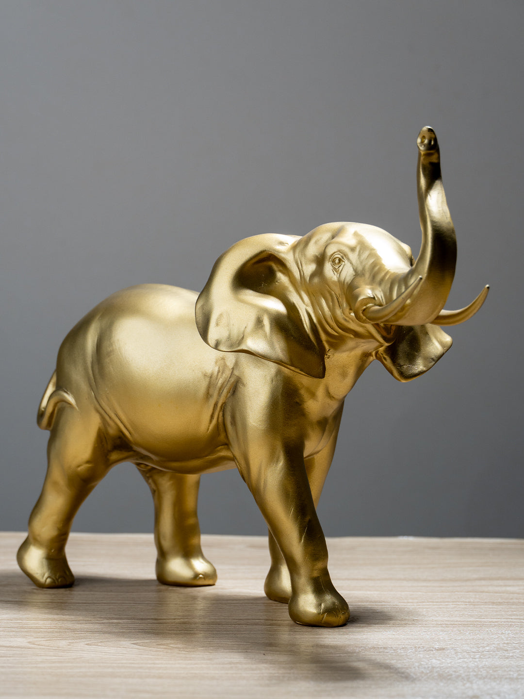 Golden Elephant Figurine with Raised Trunk