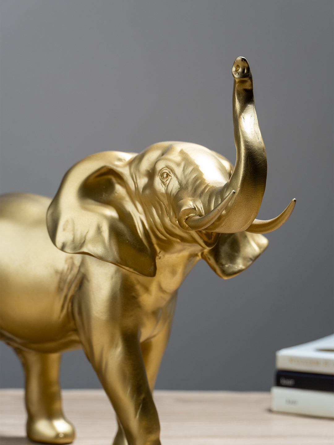 Golden Elephant Figurine with Raised Trunk