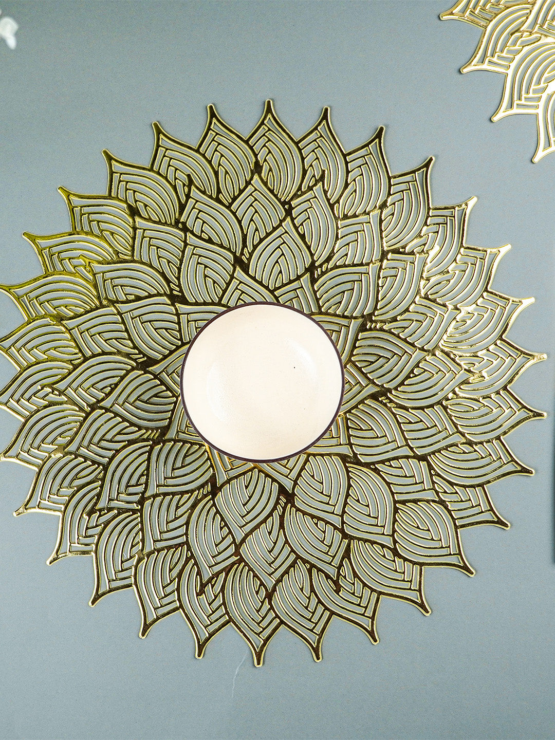 Gold Floral Cutout Table Mat with Intricate Petal Design
