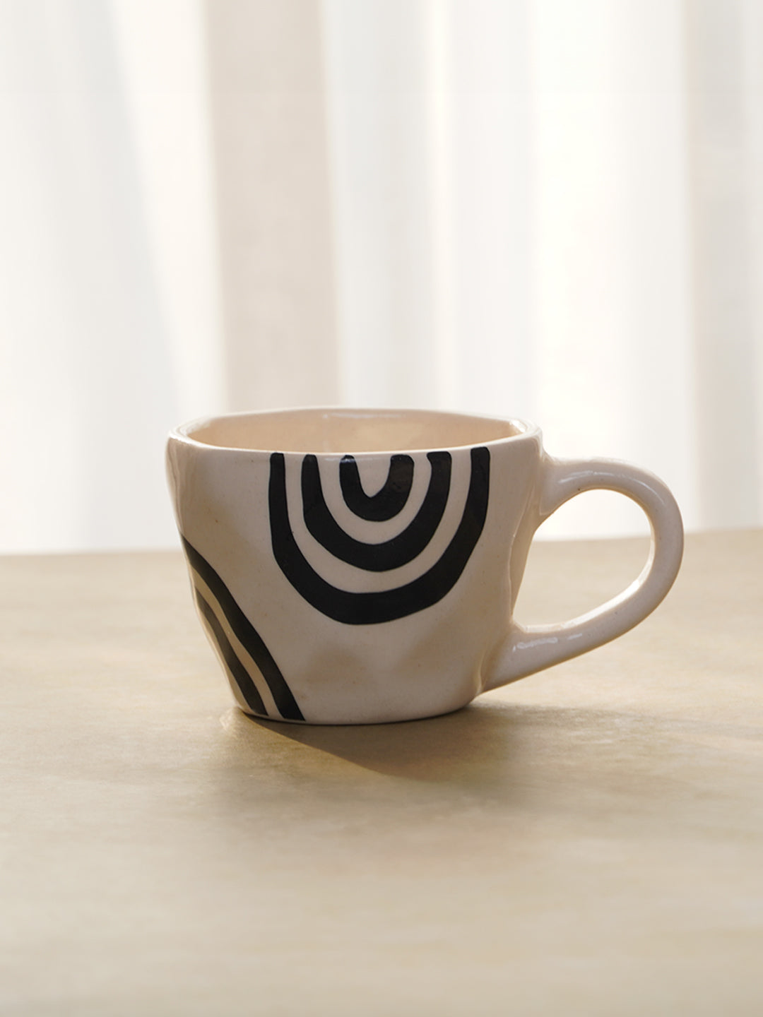 White Ceramic Mug with Hand-Painted Black Arch Design Main image