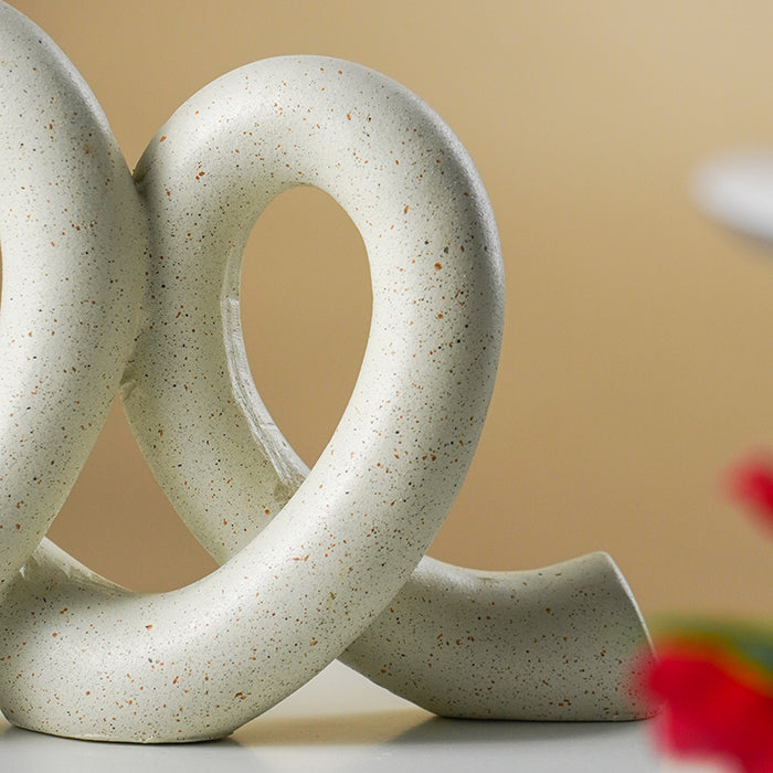 Marble Finish White Intertwined Loop Sculpture