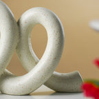 Marble Finish White Intertwined Loop Sculpture