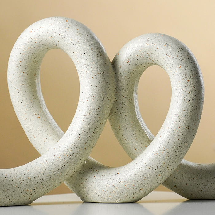 Marble Finish White Intertwined Loop Sculpture