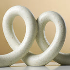 Marble Finish White Intertwined Loop Sculpture