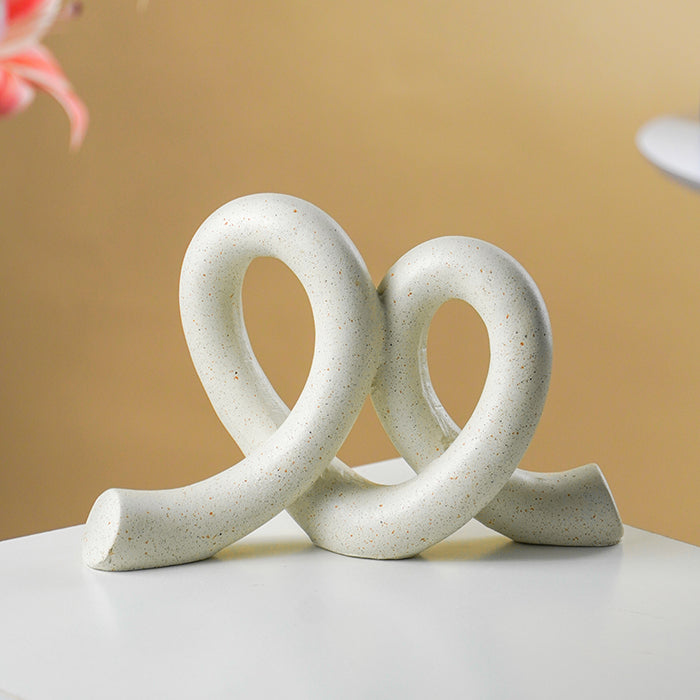 Marble Finish White Intertwined Loop Sculpture