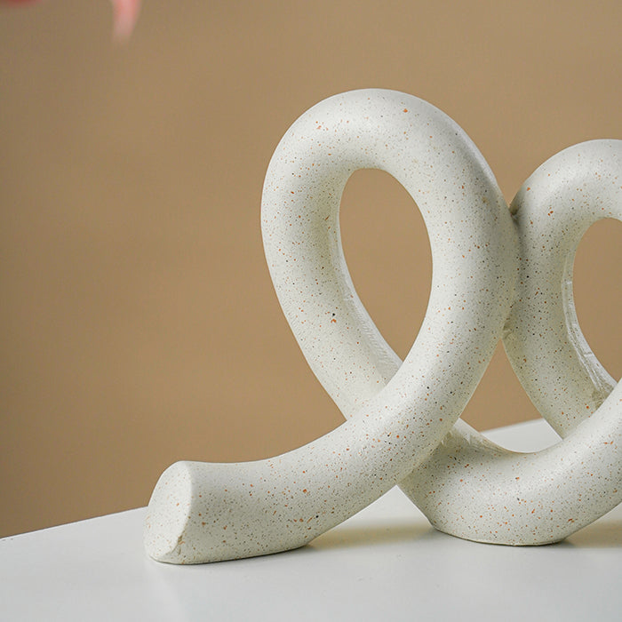 Marble Finish White Intertwined Loop Sculpture