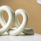 Marble Finish White Intertwined Loop Sculpture