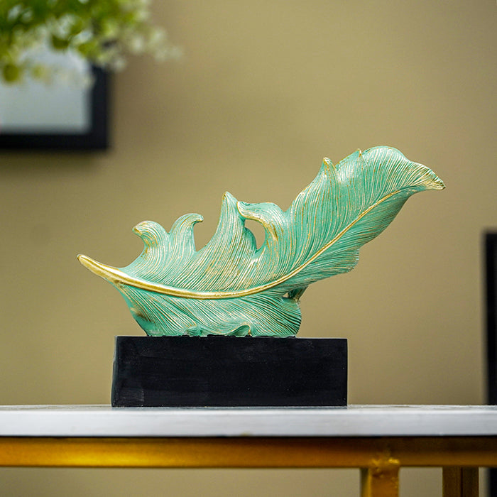 Green and Gold Feather Sculpture with Artistic Flow Design