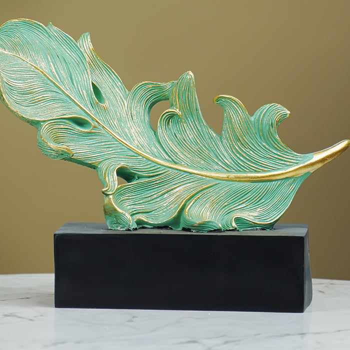 Green and Gold Feather Sculpture with Artistic Flow Design