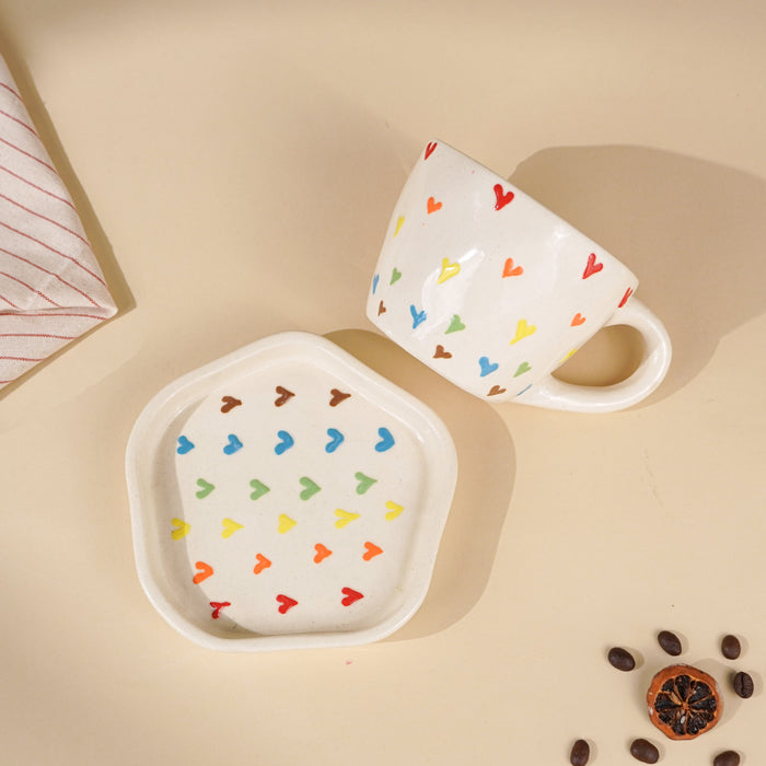 Cream Ceramic Cup with Multicolor Heart Embossed Design