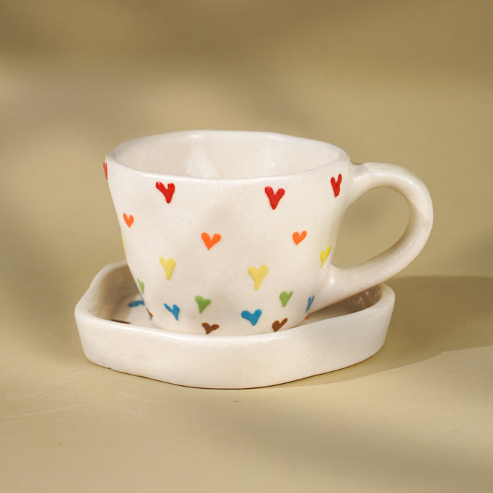 Cream Ceramic Cup with Multicolor Heart Embossed Design Main image