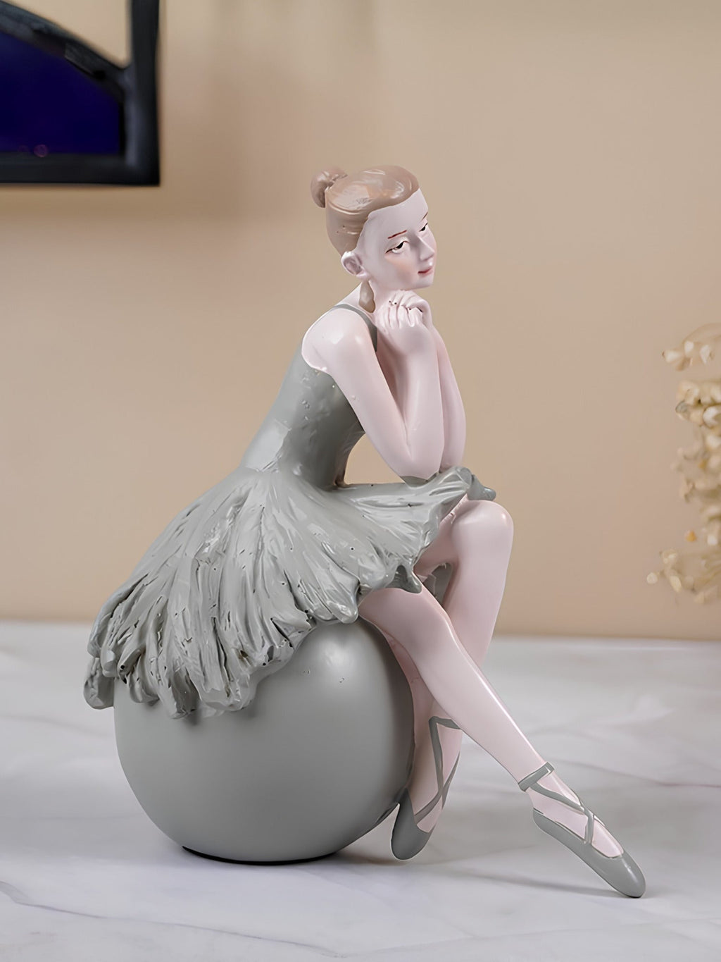 Ballerina Figurine Sitting on Sphere - The Golden Theory