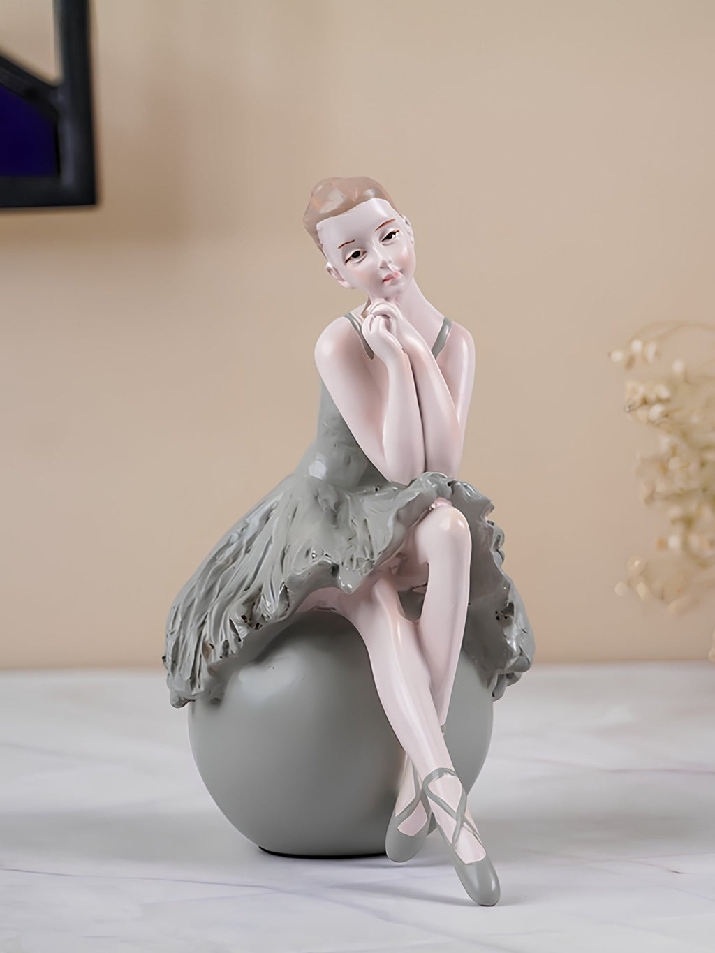 Ballerina Figurine Sitting on Sphere - The Golden Theory