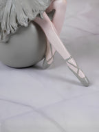 Ballerina Figurine Sitting on Sphere - The Golden Theory