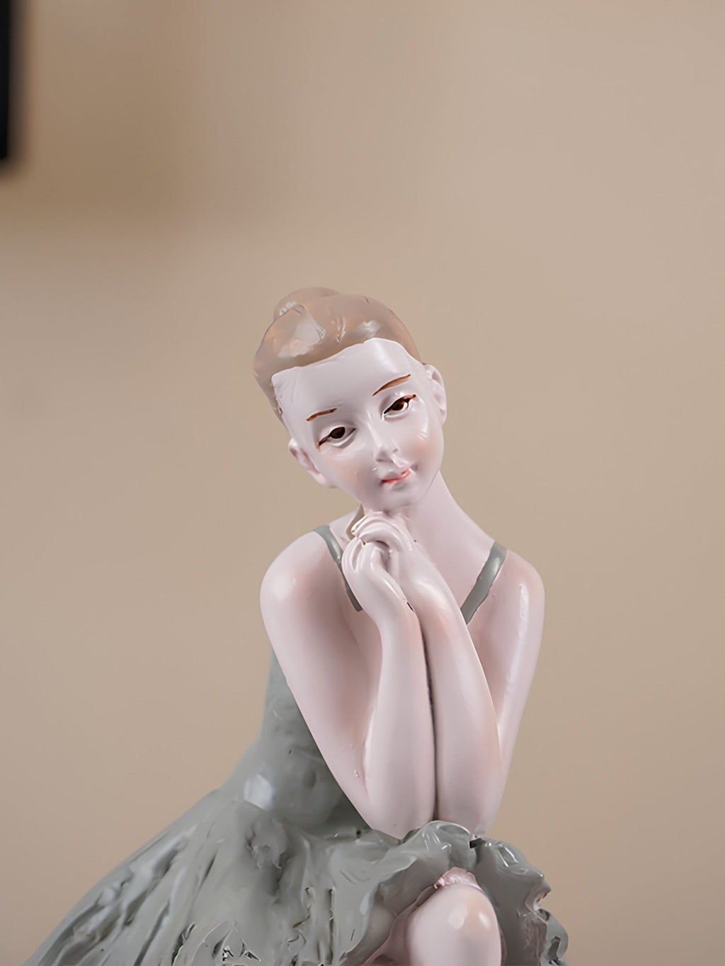 Ballerina Figurine Sitting on Sphere - The Golden Theory