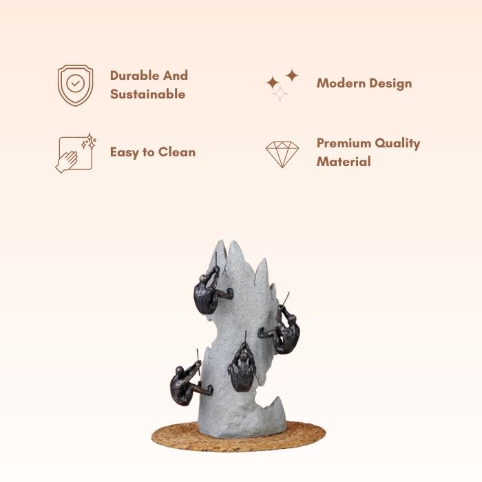 Black Climbers on Gray Rock Sculpture - The Golden Theory