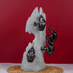 Black Climbers on Gray Rock Sculpture - The Golden Theory