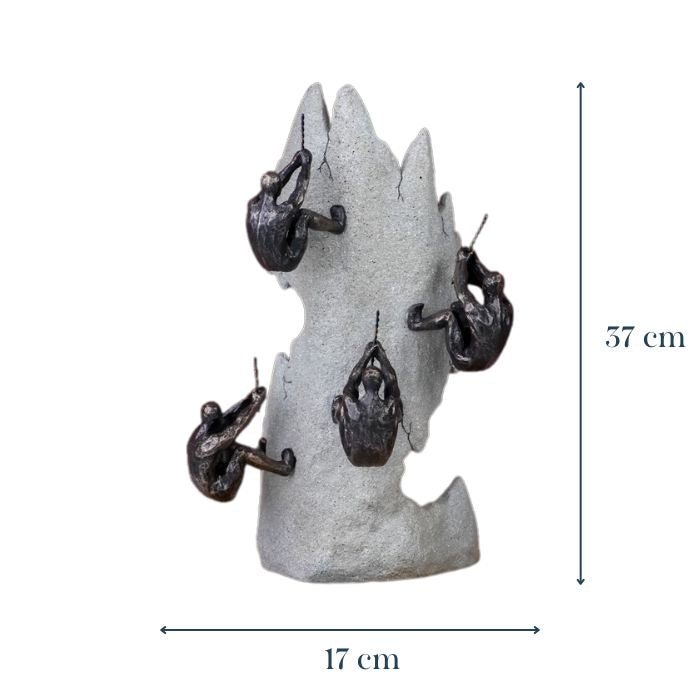 Black Climbers on Gray Rock Sculpture - The Golden Theory