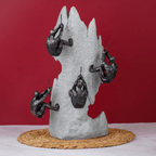 Black Climbers on Gray Rock Sculpture - The Golden Theory
