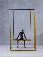Black Figure on Gold Swing - The Golden Theory