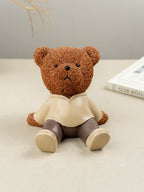 Brown Textured Teddy Bear Figurine in Yellow Shirt - The Golden Theory