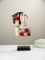 Colorful Abstract Face Sculpture with Red Bird - The Golden Theory