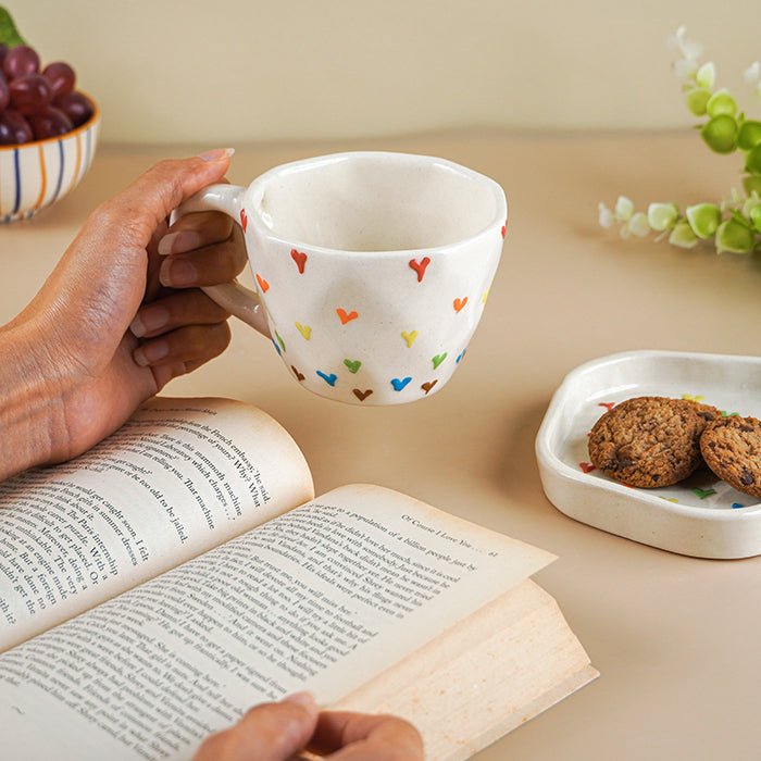 Cream Ceramic Cup with Multicolor Heart Embossed Design - The Golden Theory