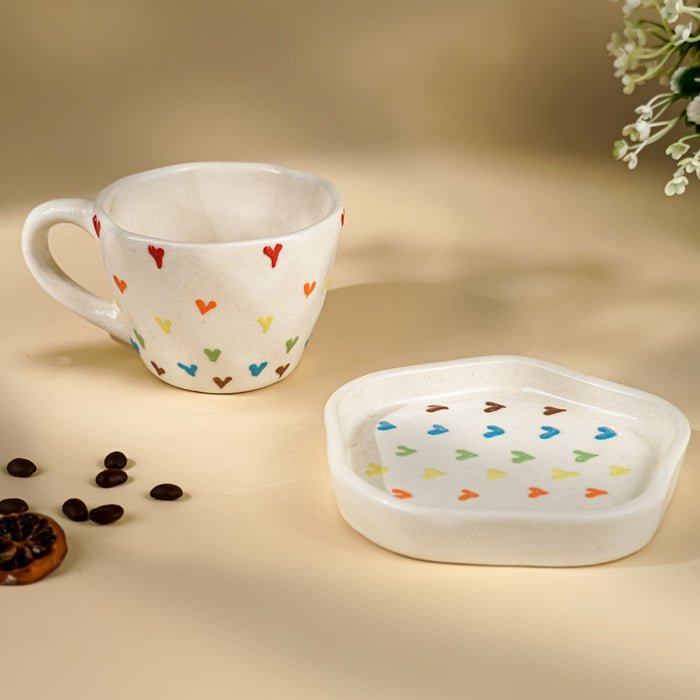 Cream Ceramic Cup with Multicolor Heart Embossed Design - The Golden Theory