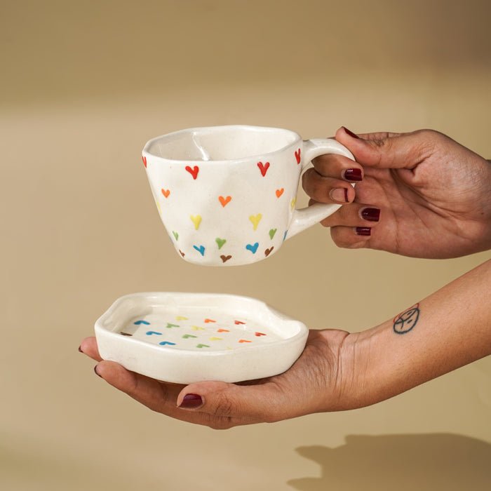 Cream Ceramic Cup with Multicolor Heart Embossed Design - The Golden Theory