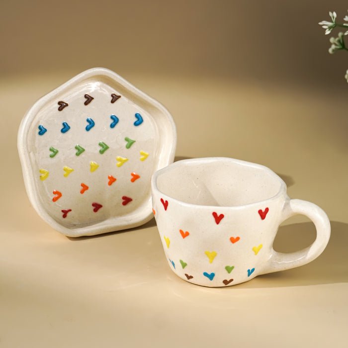 Cream Ceramic Cup with Multicolor Heart Embossed Design - The Golden Theory