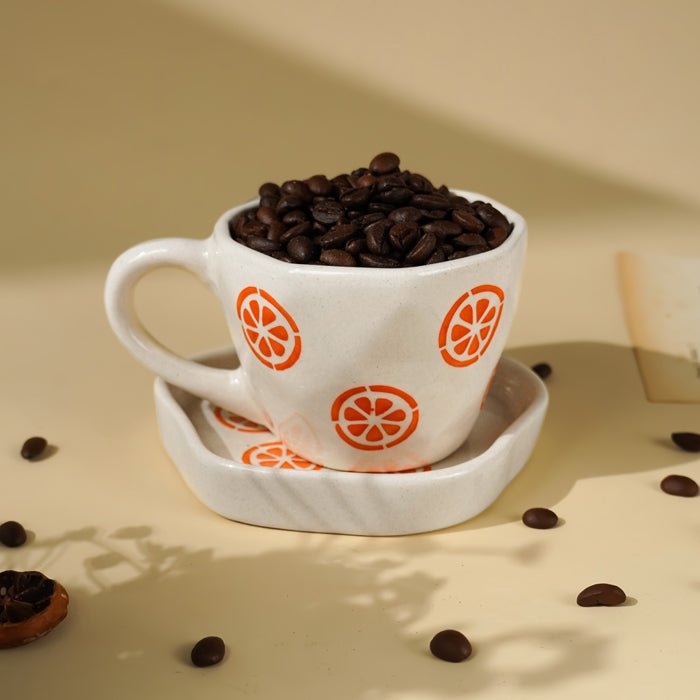 Cream Ceramic Cup with Orange Slice Motif - The Golden Theory