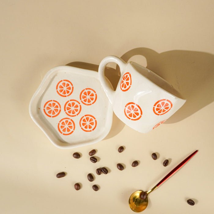 Cream Ceramic Cup with Orange Slice Motif - The Golden Theory