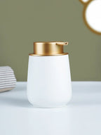 Elegant White Soap Dispenser with Gold Accents - The Golden Theory