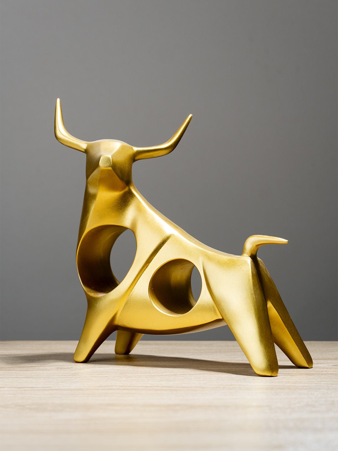 Gold Bull Sculpture with Geometric Cutouts - The Golden Theory