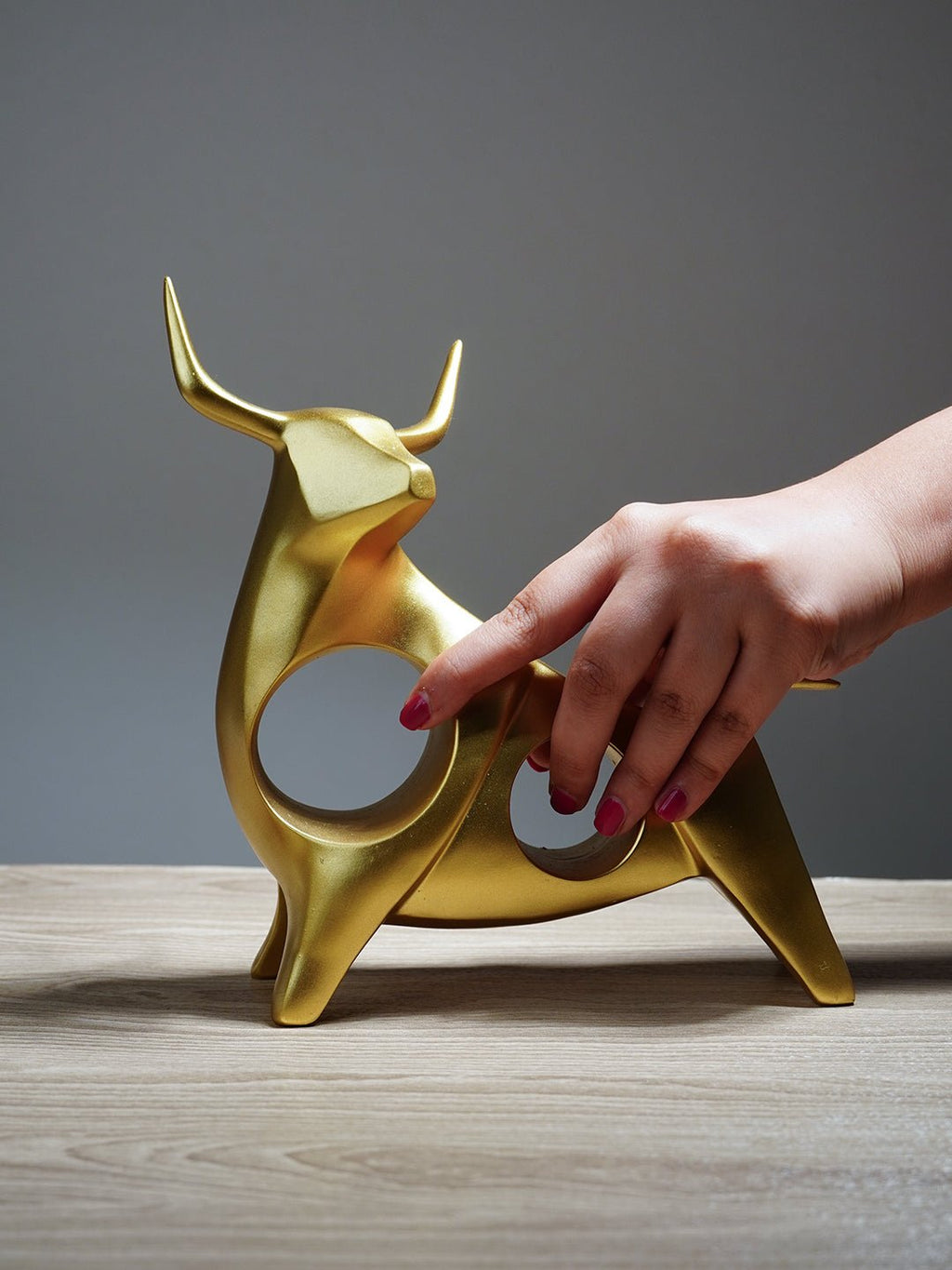 Gold Bull Sculpture with Geometric Cutouts - The Golden Theory