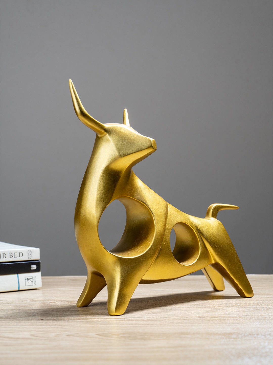 Gold Bull Sculpture with Geometric Cutouts - The Golden Theory Main image