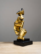 Gold Face Sculpture with Shhh Gesture - The Golden Theory