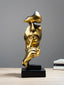Gold Face Sculpture with Shhh Gesture - The Golden Theory