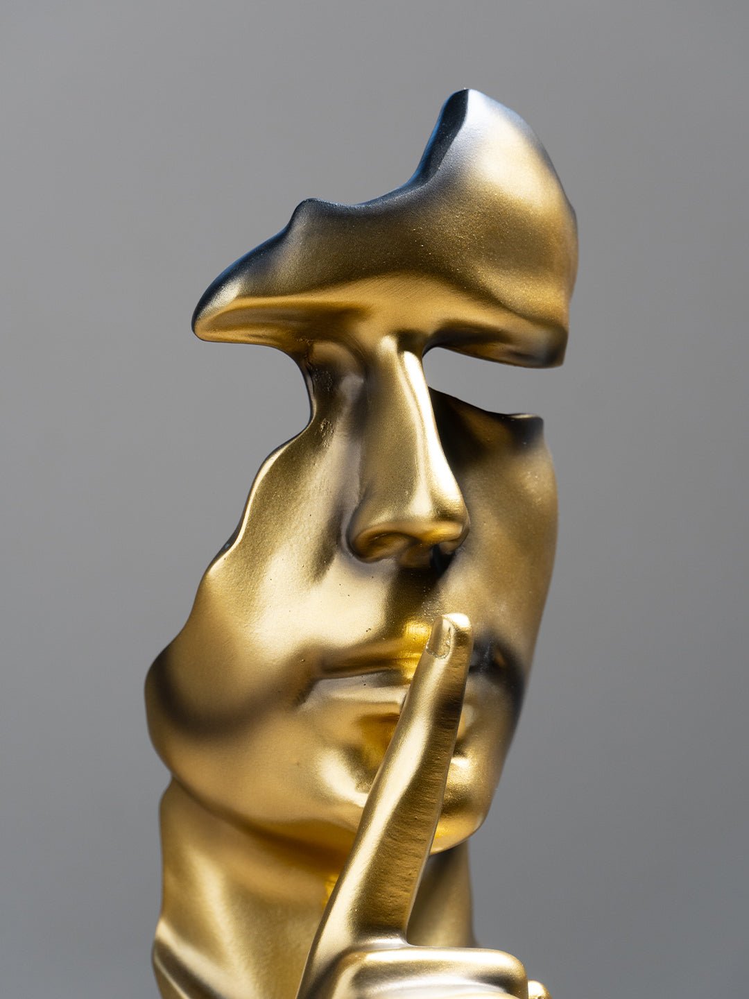 Gold Face Sculpture with Shhh Gesture - The Golden Theory