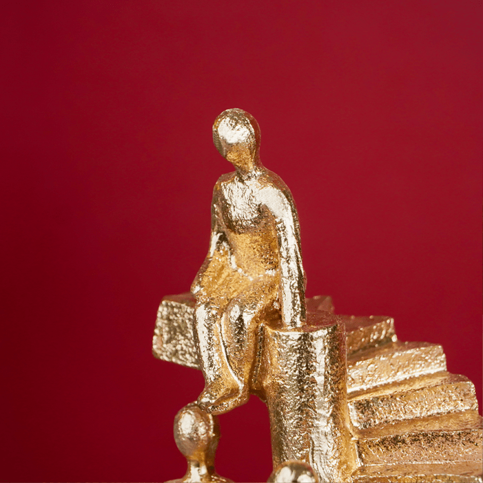 Gold Figures on Spiral Staircase Sculpture - The Golden Theory