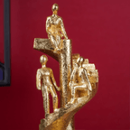Gold Figures on Spiral Staircase Sculpture - The Golden Theory