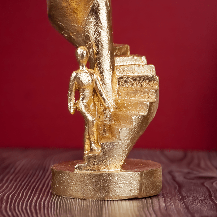 Gold Figures on Spiral Staircase Sculpture - The Golden Theory