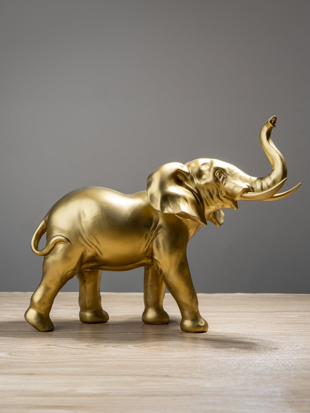 Golden Elephant Figurine with Raised Trunk - The Golden Theory Main image