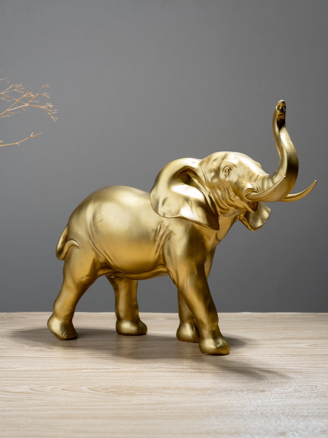 Golden Elephant Figurine with Raised Trunk Secondary image